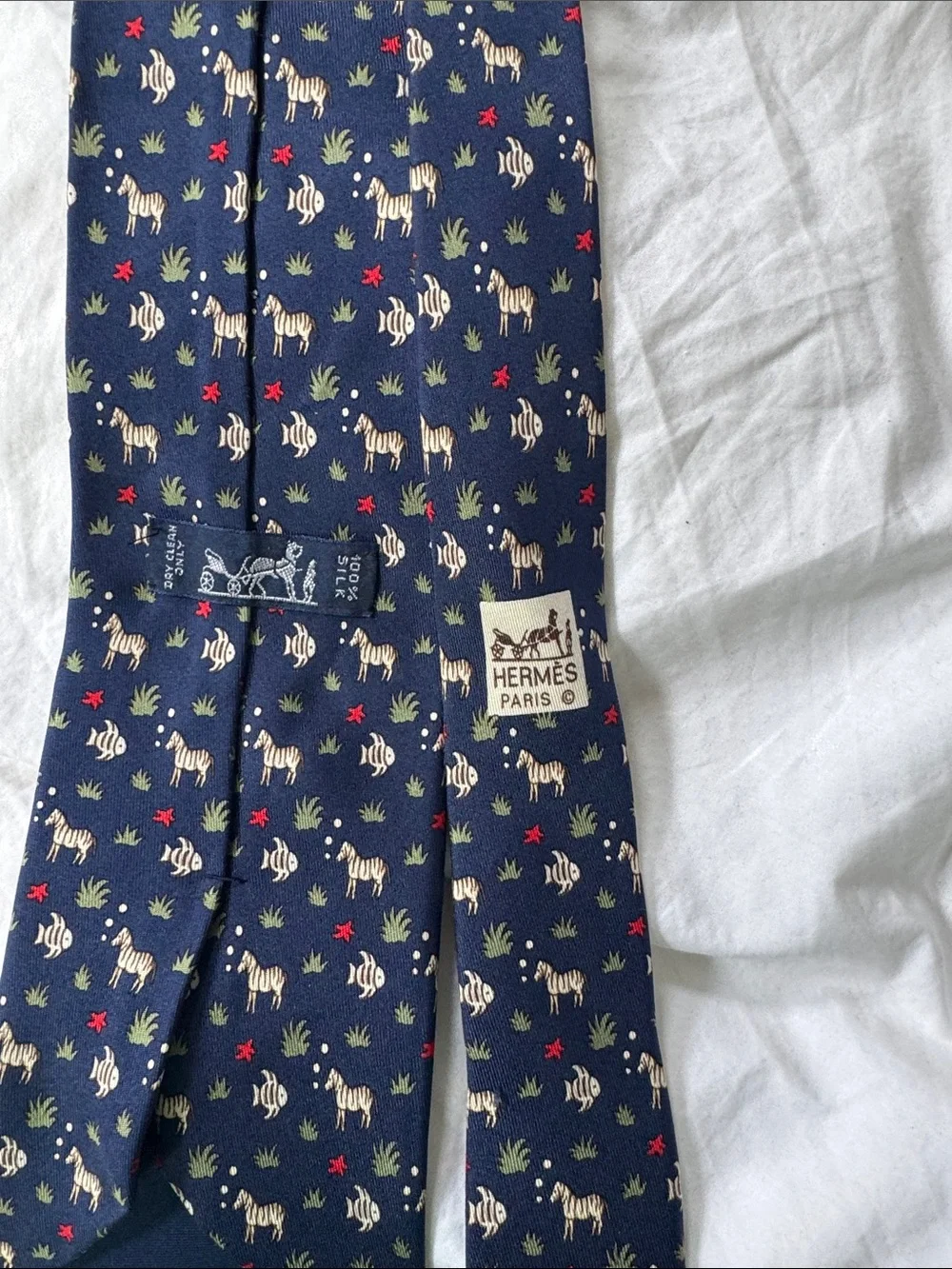 Hermès, navy silk necktie with fish and zebras and starfish MINT